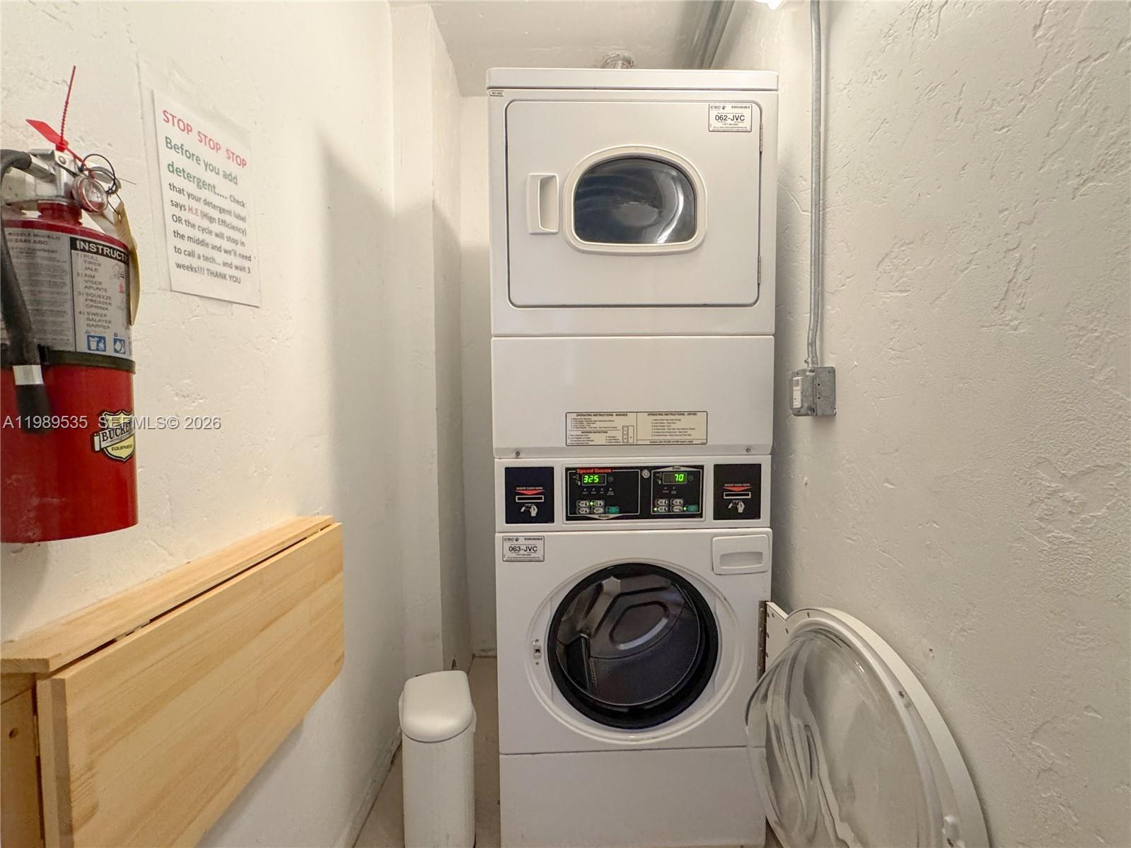 290 Sunrise Drive, Unit 3F Key Biscayne, FL 33149 - Photo 14 of 19 a utility room with dryer and washer
