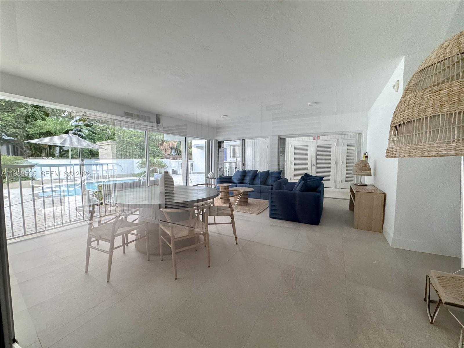 290 Sunrise Drive, Unit 3F Key Biscayne, FL 33149 - Photo 17 of 19 a living room with furniture and a large window