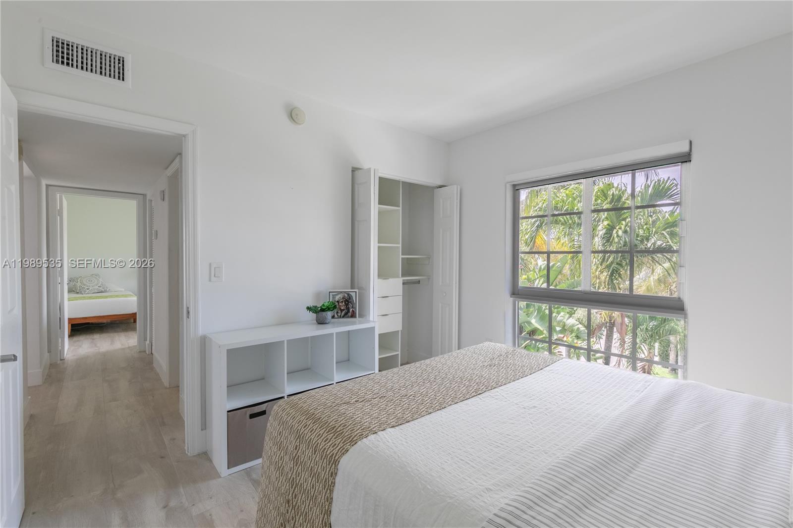 290 Sunrise Drive, Unit 3F Key Biscayne, FL 33149 - Photo 5 of 19 a bedroom with a bed and a large window
