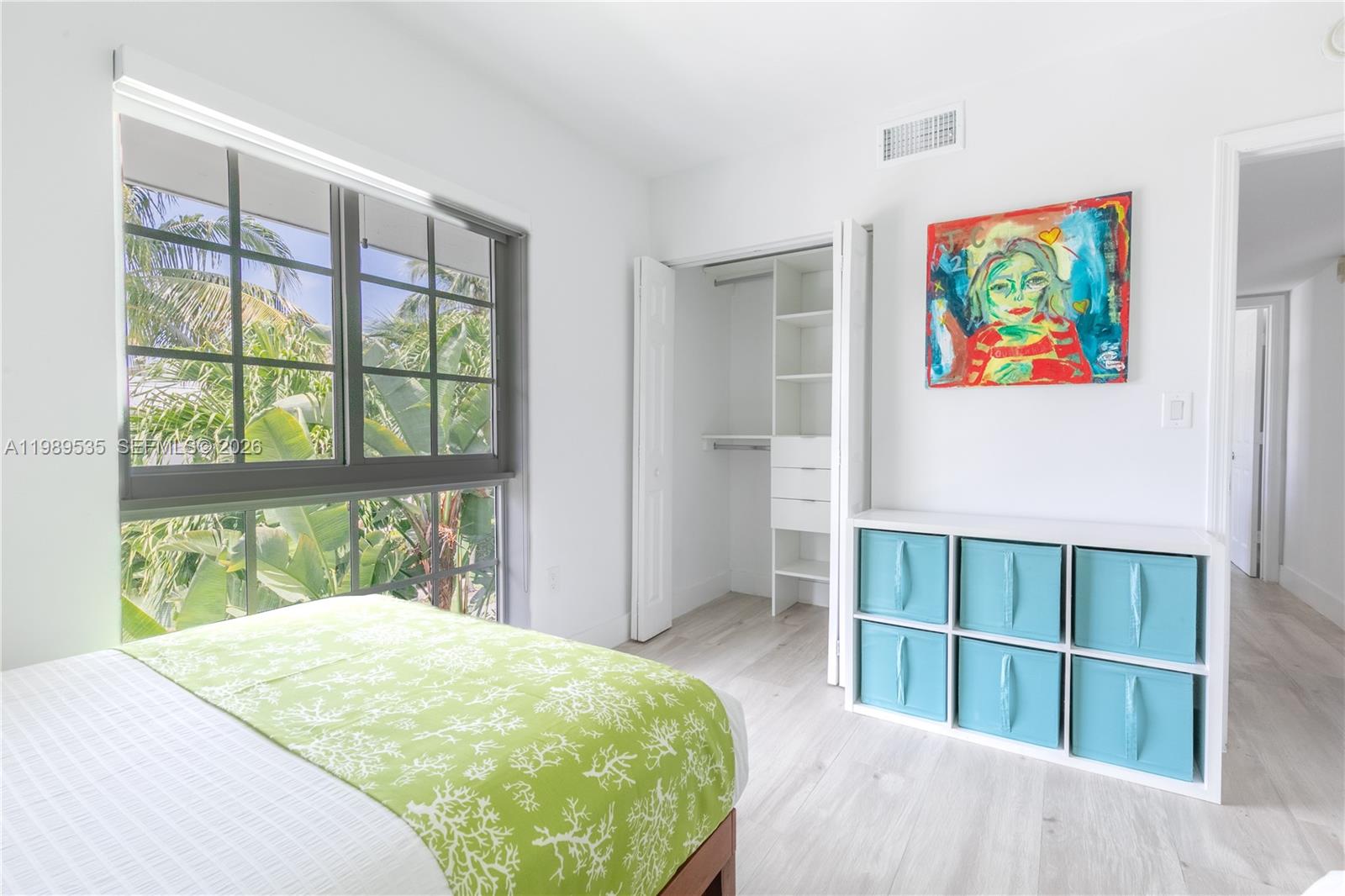 290 Sunrise Drive, Unit 3F Key Biscayne, FL 33149 - Photo 7 of 19 a bed sitting in a bedroom next to a window