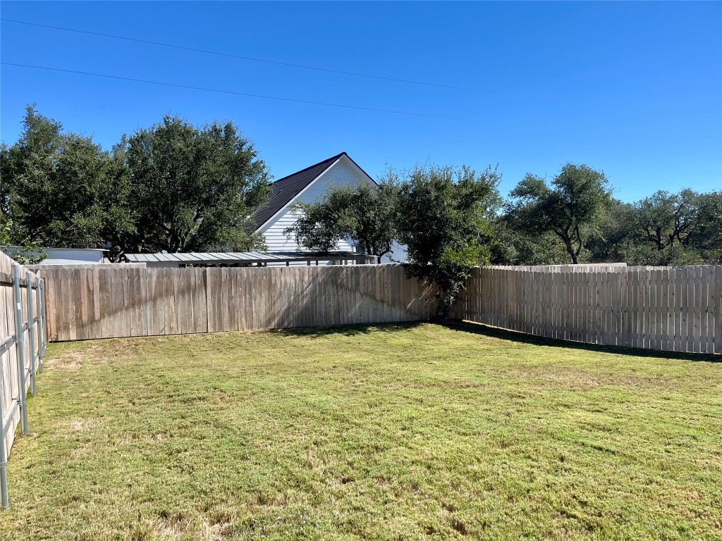 320 Creek Road, Unit 203 Dripping Springs, TX 78620 - Photo 11 of 14 a view of backyard with green space