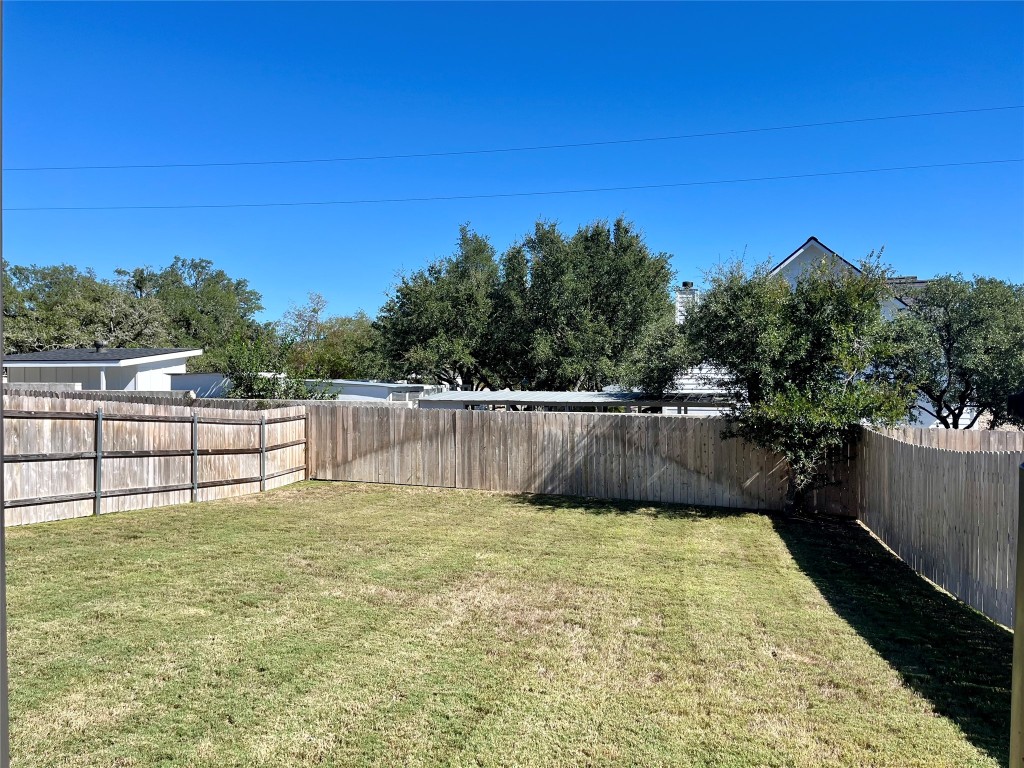 320 Creek Road, Unit 203 Dripping Springs, TX 78620 - Photo 12 of 14 a view of swimming pool with a yard
