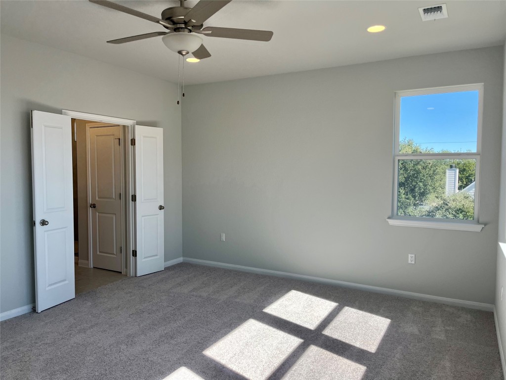 320 Creek Road, Unit 203 Dripping Springs, TX 78620 - Photo 5 of 14 wooden floor in an empty room with a window