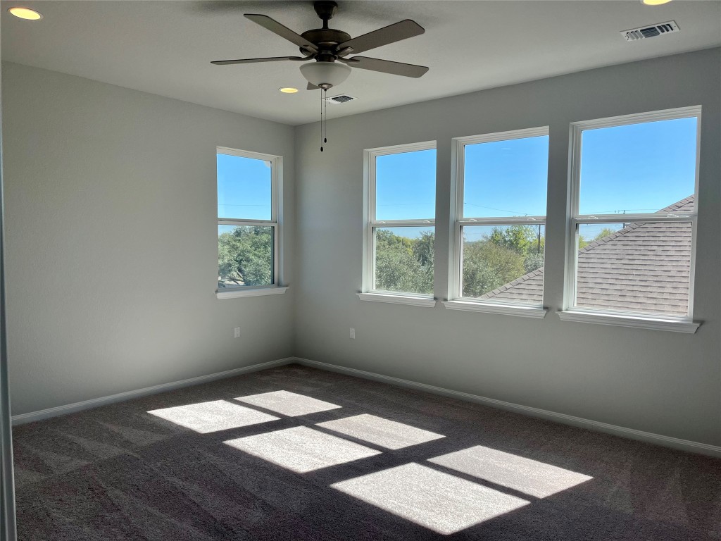 320 Creek Road, Unit 203 Dripping Springs, TX 78620 - Photo 6 of 14 a view of an empty room with a window