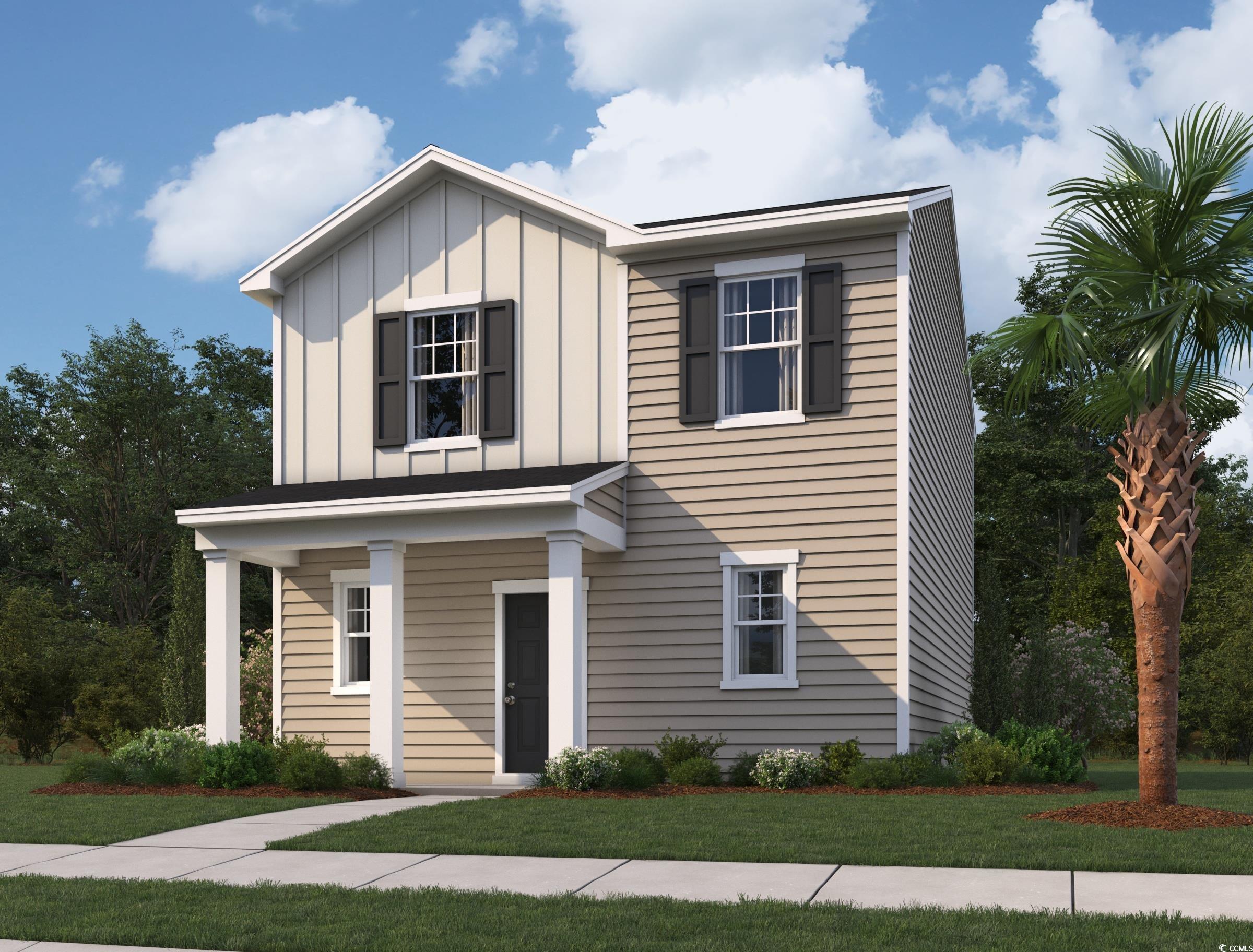 View of front facade with board and batten siding, a front yard, and covered porch