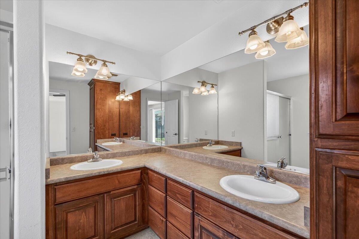2618 Rabun Way Central Point, OR 97502 - Photo 27 of 42 a bathroom with a sink double vanity and a mirror