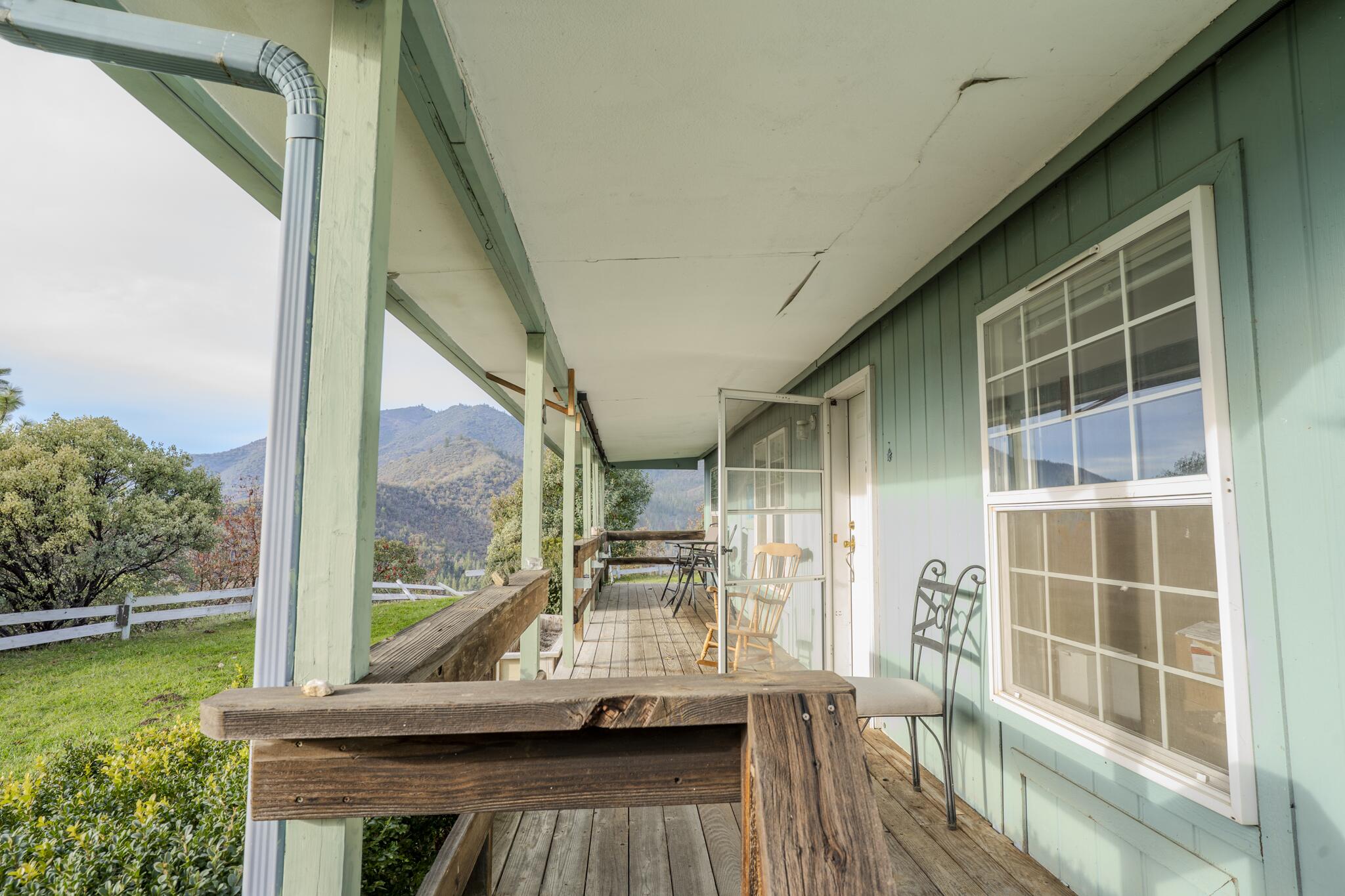 362 Humbug Creek Road Jacksonville, OR 97530 - Photo 17 of 49 a view of balcony with mountain view and wooden floor