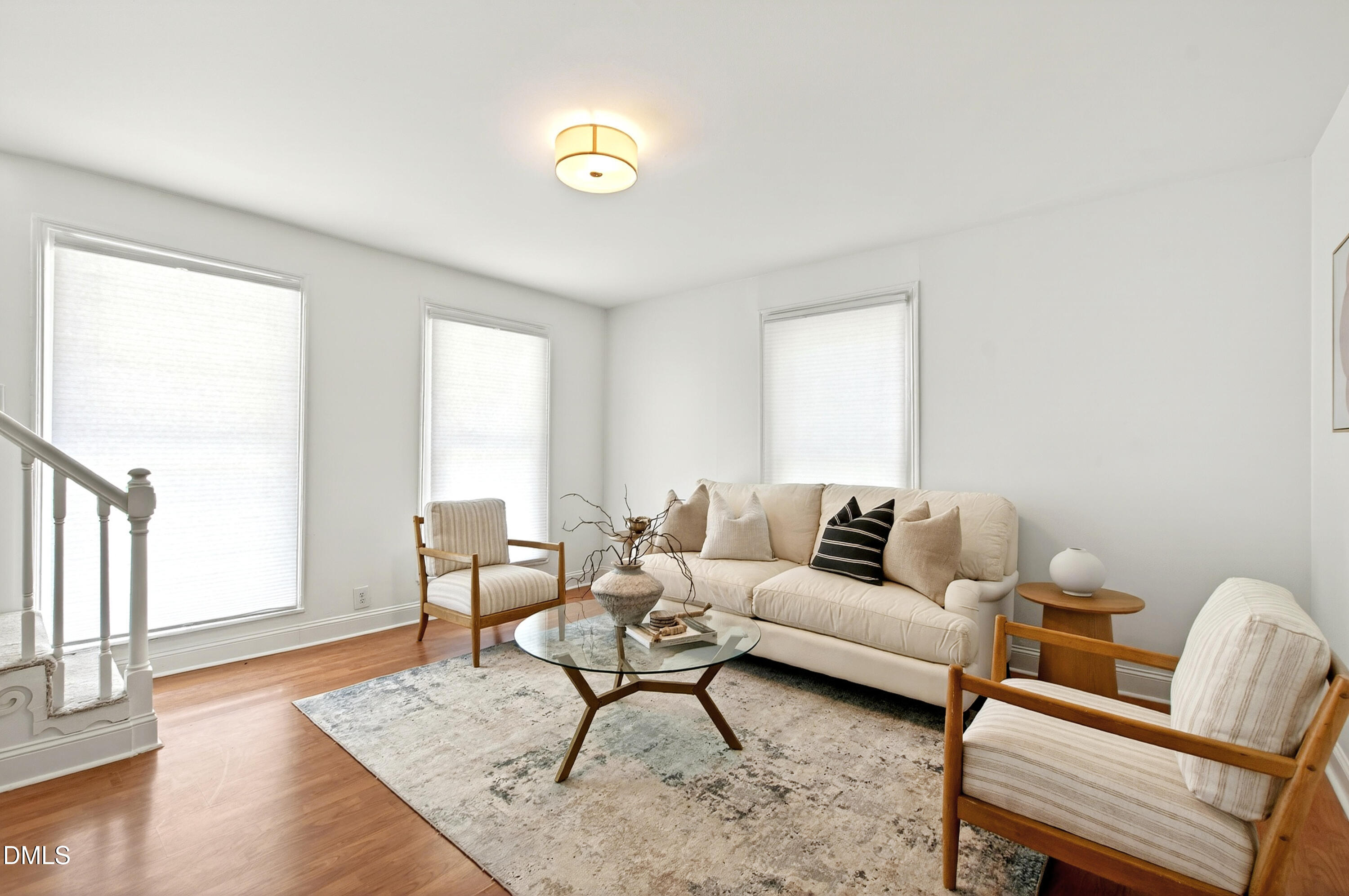 913 Washington Street Durham, NC 27701 - Photo 12 of 37 a living room with furniture and a wooden floor