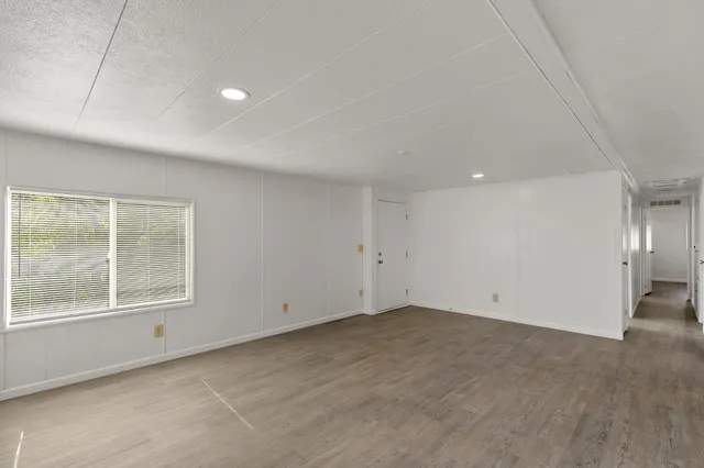 an empty room with a empty space and window