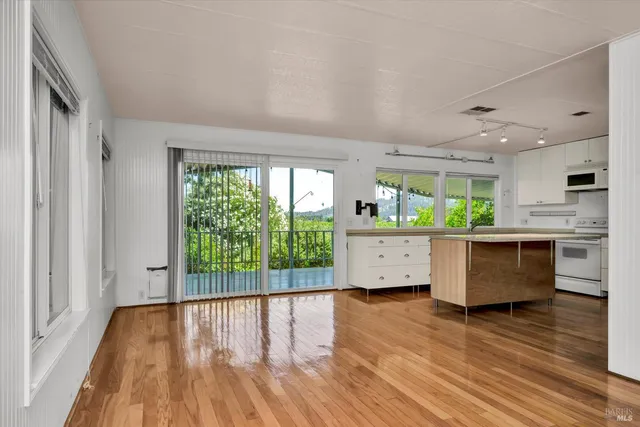 a view of kitchen and wooden floor