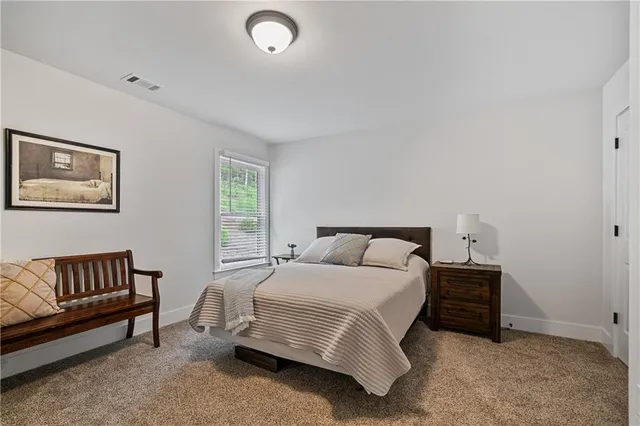 a bathroom with double sink and a mirror