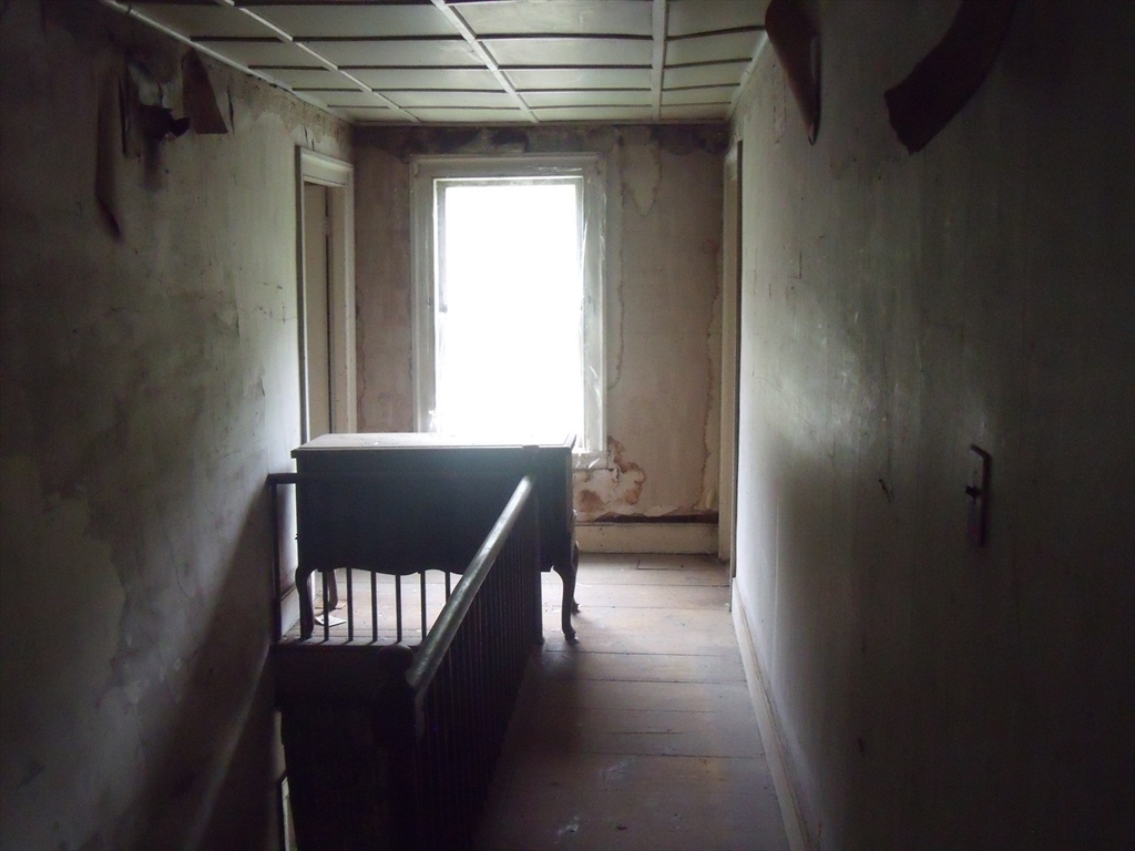 35 Goshen Road Williamsburg, MA 01096 - Photo 7 of 21 a view of a hallway with wooden floor and windows