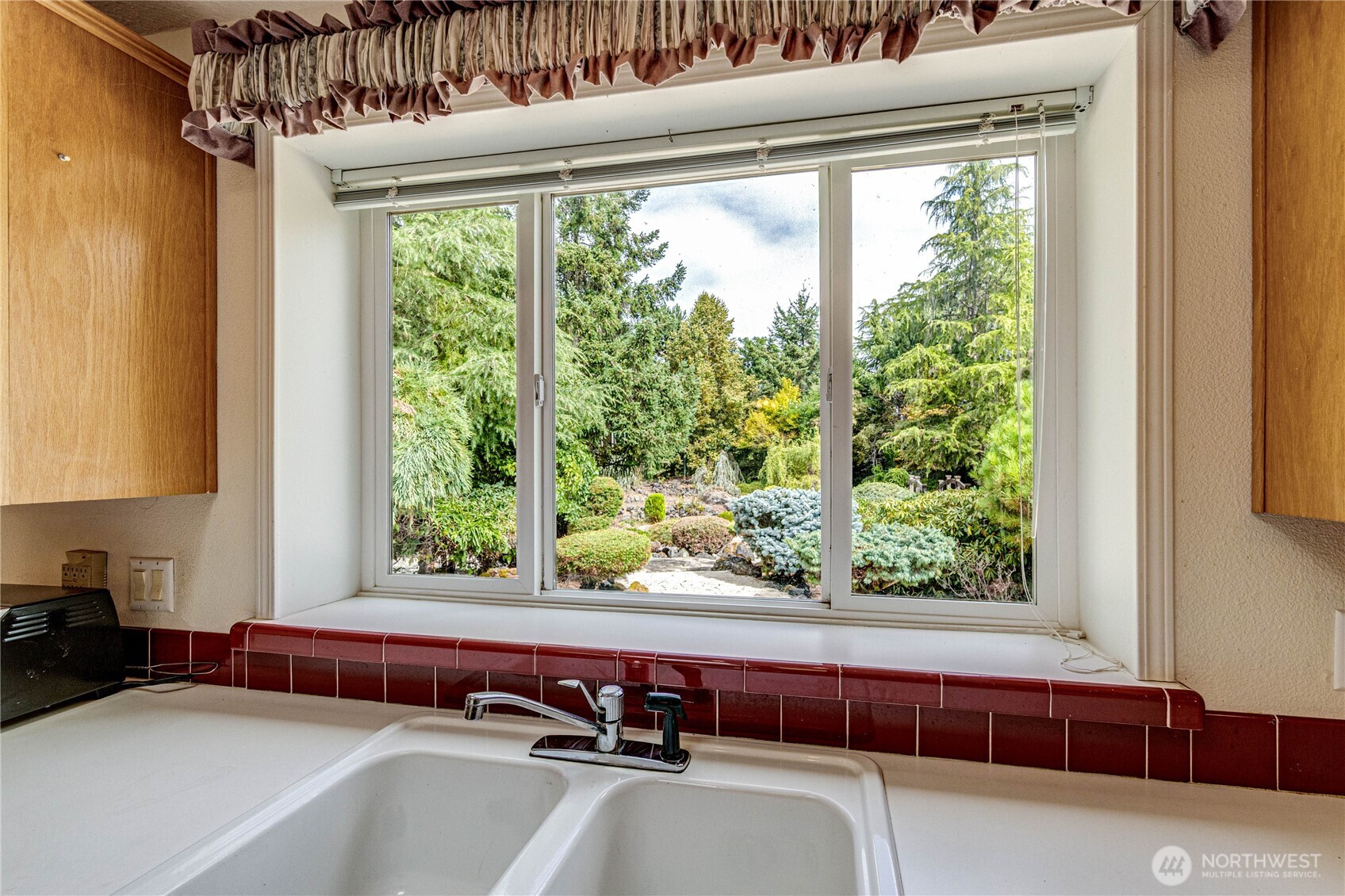 62 Johnson Road Port Angeles, WA 98363 - Photo 11 of 38 a bath tub sitting in a bathroom next to a window