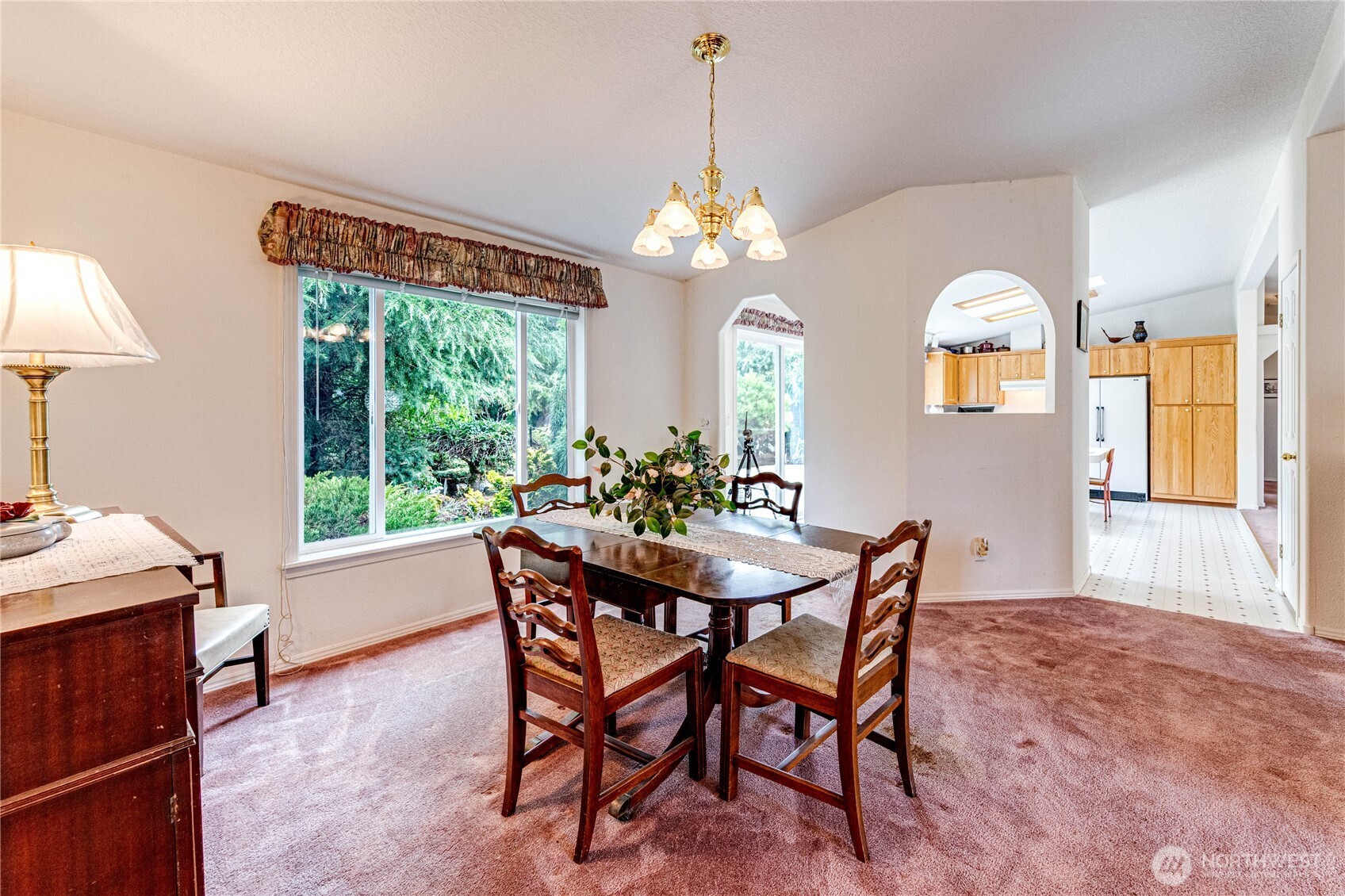 62 Johnson Road Port Angeles, WA 98363 - Photo 13 of 38 a dining room with furniture a chandelier and a rug
