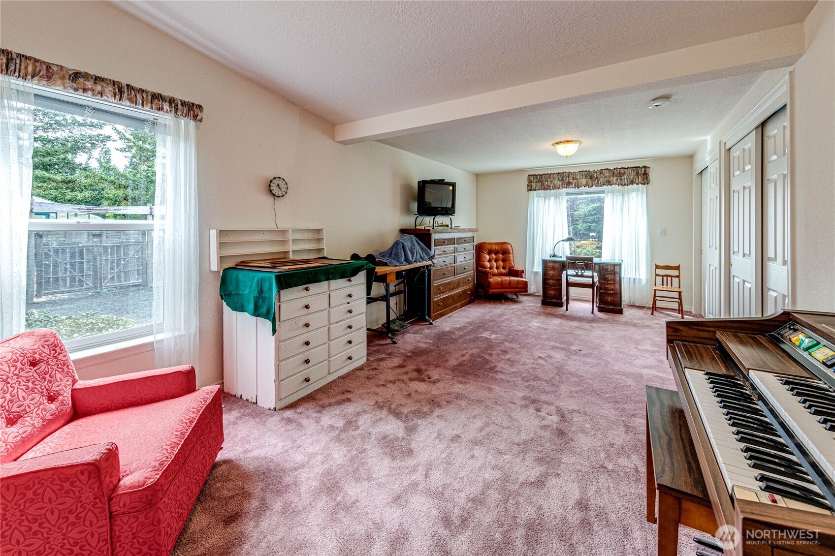 62 Johnson Road Port Angeles, WA 98363 - Photo 26 of 38 a living room with furniture and a flat screen tv