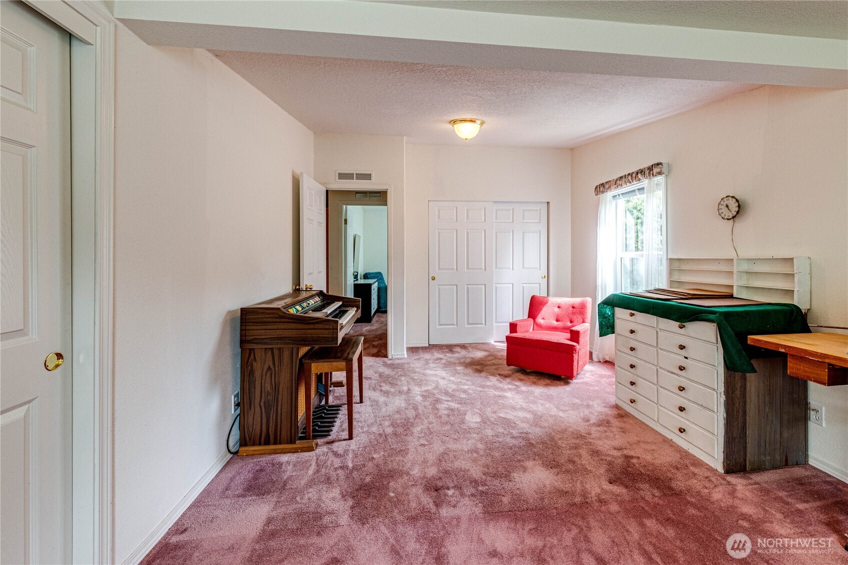 62 Johnson Road Port Angeles, WA 98363 - Photo 27 of 38 a bedroom with a bed and a dresser