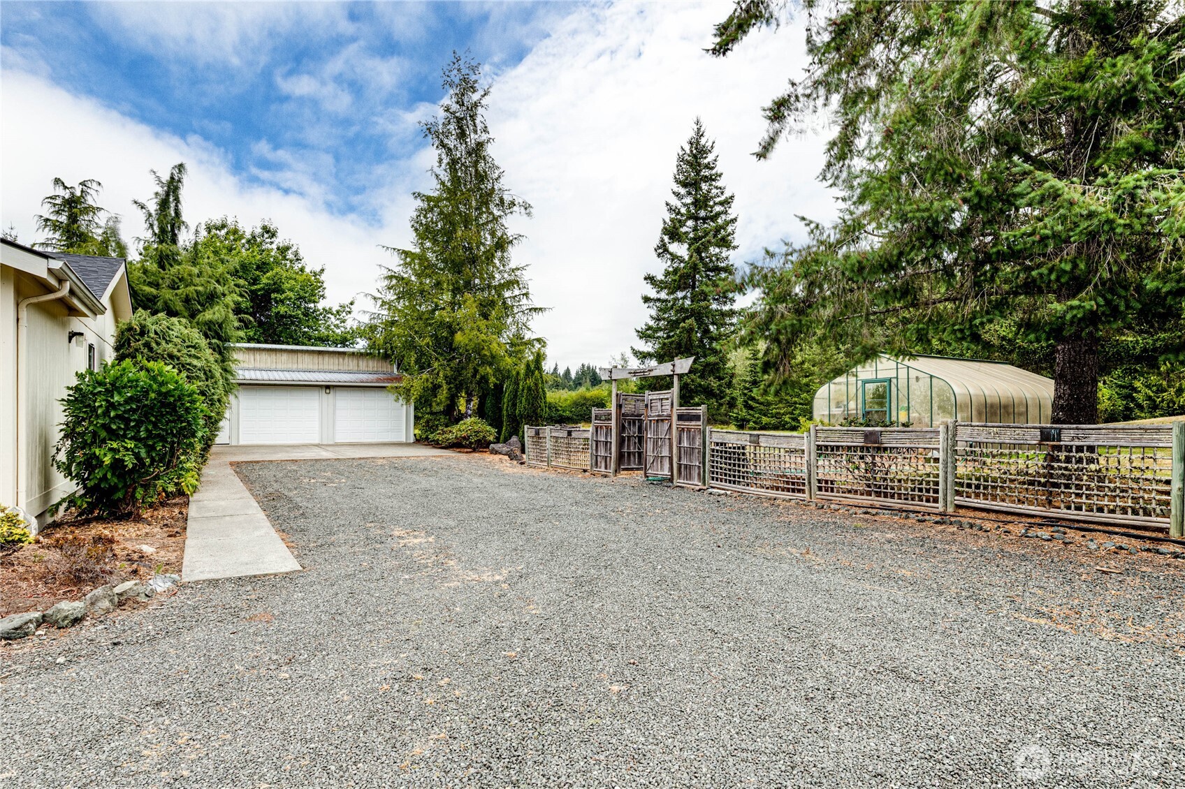 62 Johnson Road Port Angeles, WA 98363 - Photo 34 of 38 a view of a house with a yard and garage