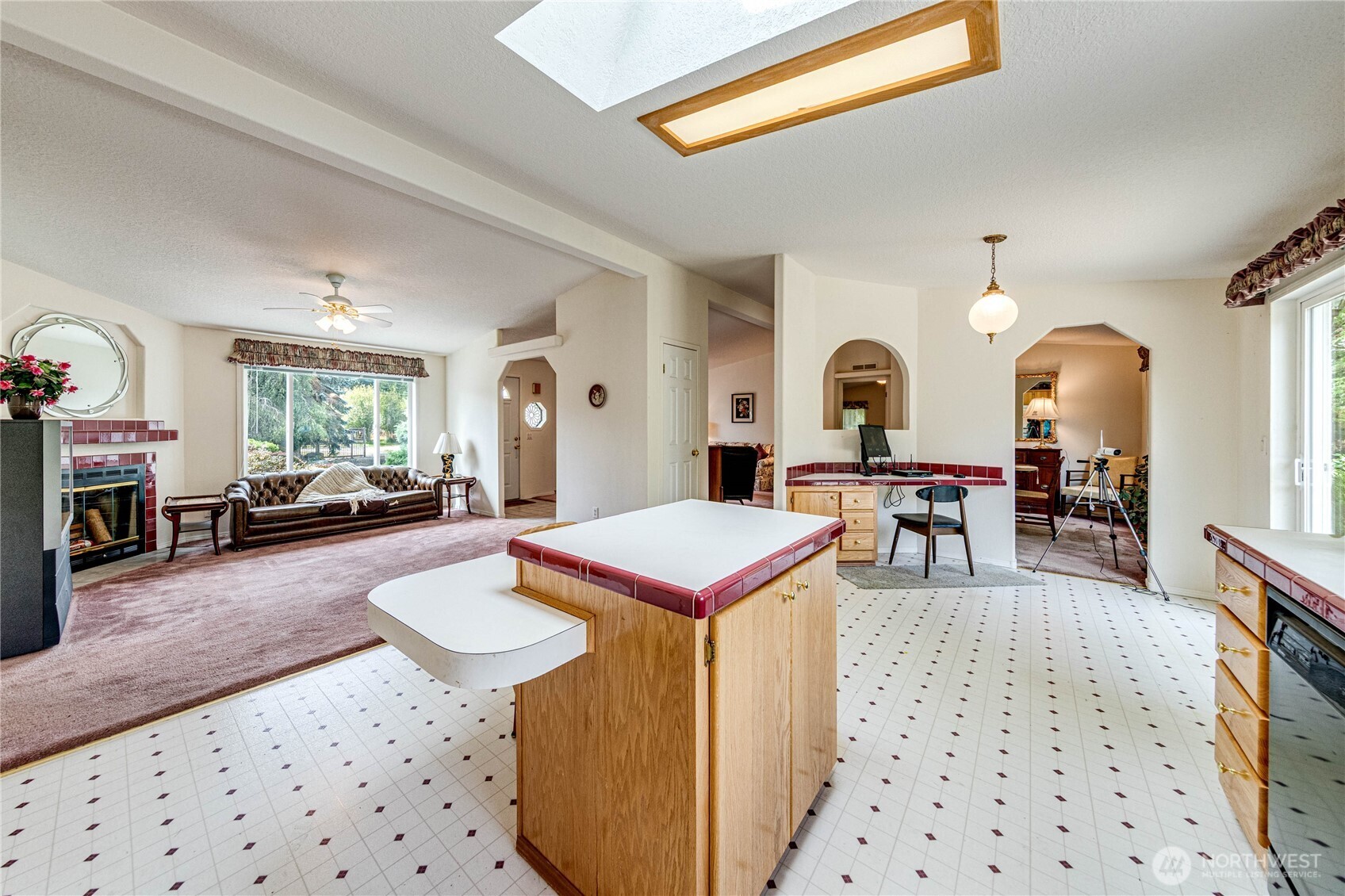 62 Johnson Road Port Angeles, WA 98363 - Photo 9 of 38 a living room with furniture a rug and a chandelier