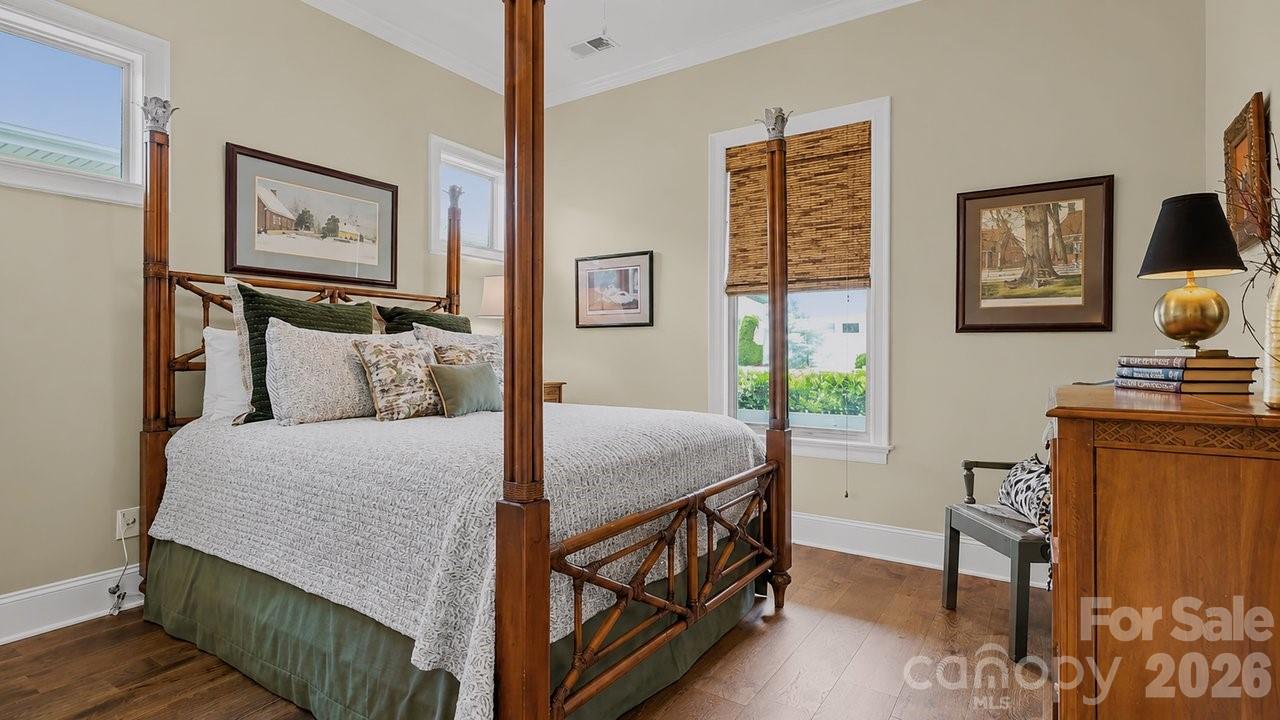 4854 Looking Glass Trail Denver, NC 28037 - Photo 42 of 48 a bedroom with a bed a painting on the wall and a dresser
