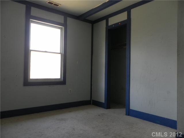 7296 Shiloh Unity Road Lancaster, SC 29720 - Photo 4 of 9 a view of an empty room with a window