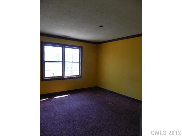7296 Shiloh Unity Road Lancaster, SC 29720 - Photo 5 of 9 a view of an empty room with a window
