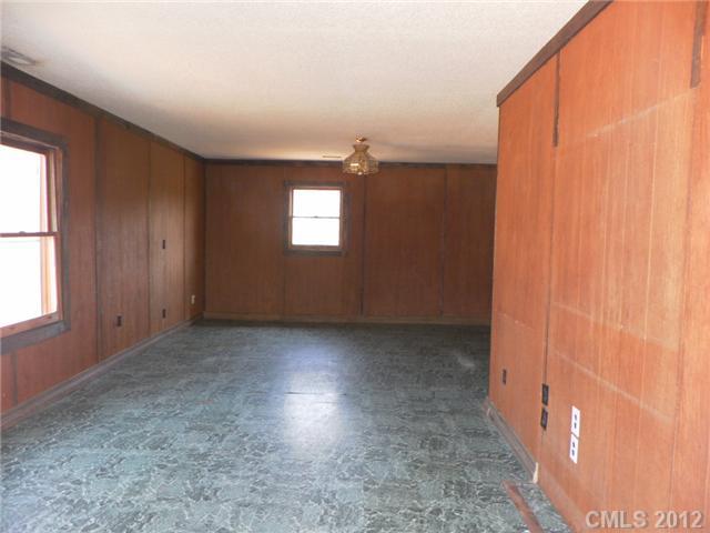 7296 Shiloh Unity Road Lancaster, SC 29720 - Photo 7 of 9 an empty room with windows