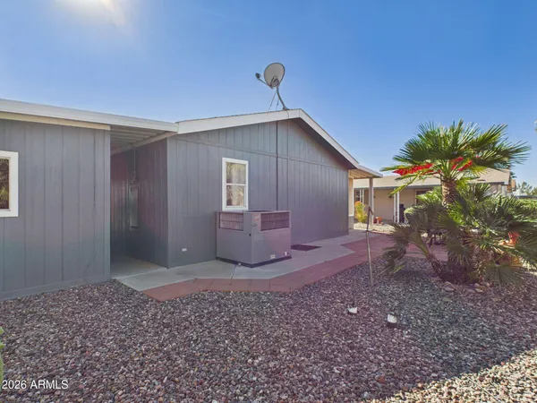 a view of a house with backyard and garden