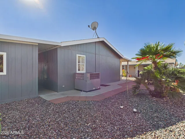 a view of a house with backyard and garden