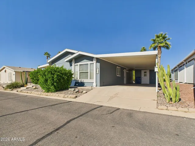 a view of a house with a yard and garage