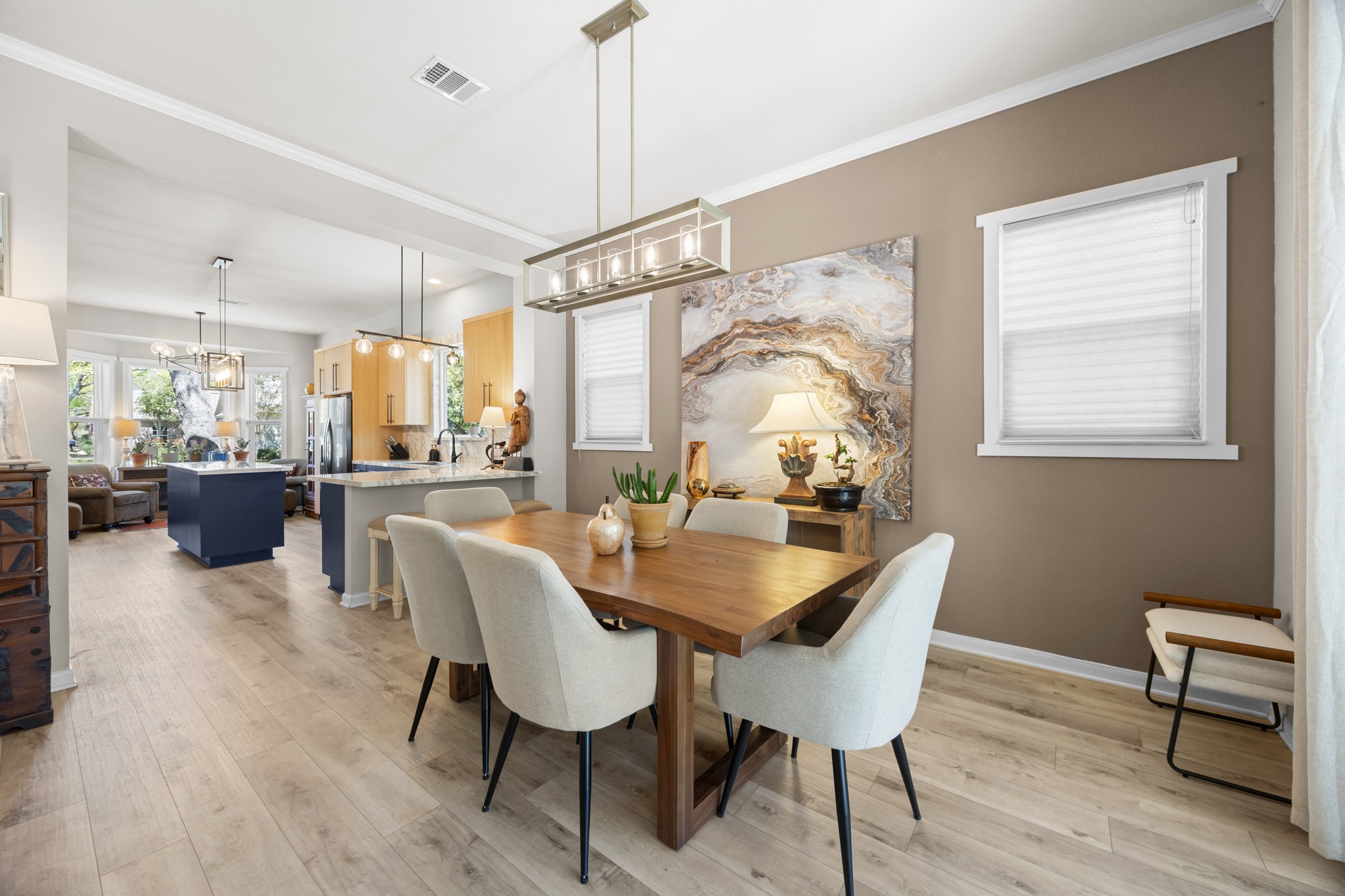 168 Dan Moody Trail Georgetown, TX 78633 - Photo 13 of 40 a dining room with furniture a chandelier and wooden floor