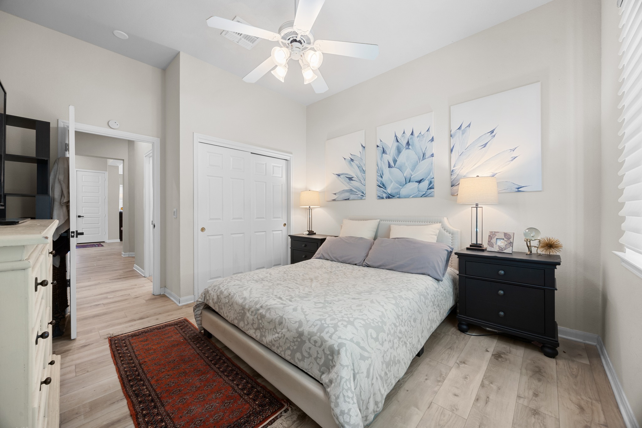 168 Dan Moody Trail Georgetown, TX 78633 - Photo 31 of 40 a bedroom with a bed and a chandelier