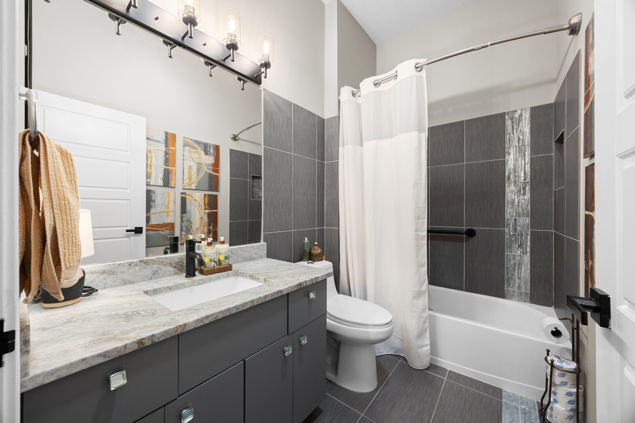 168 Dan Moody Trail Georgetown, TX 78633 - Photo 32 of 40 a bathroom with a granite countertop sink toilet and shower