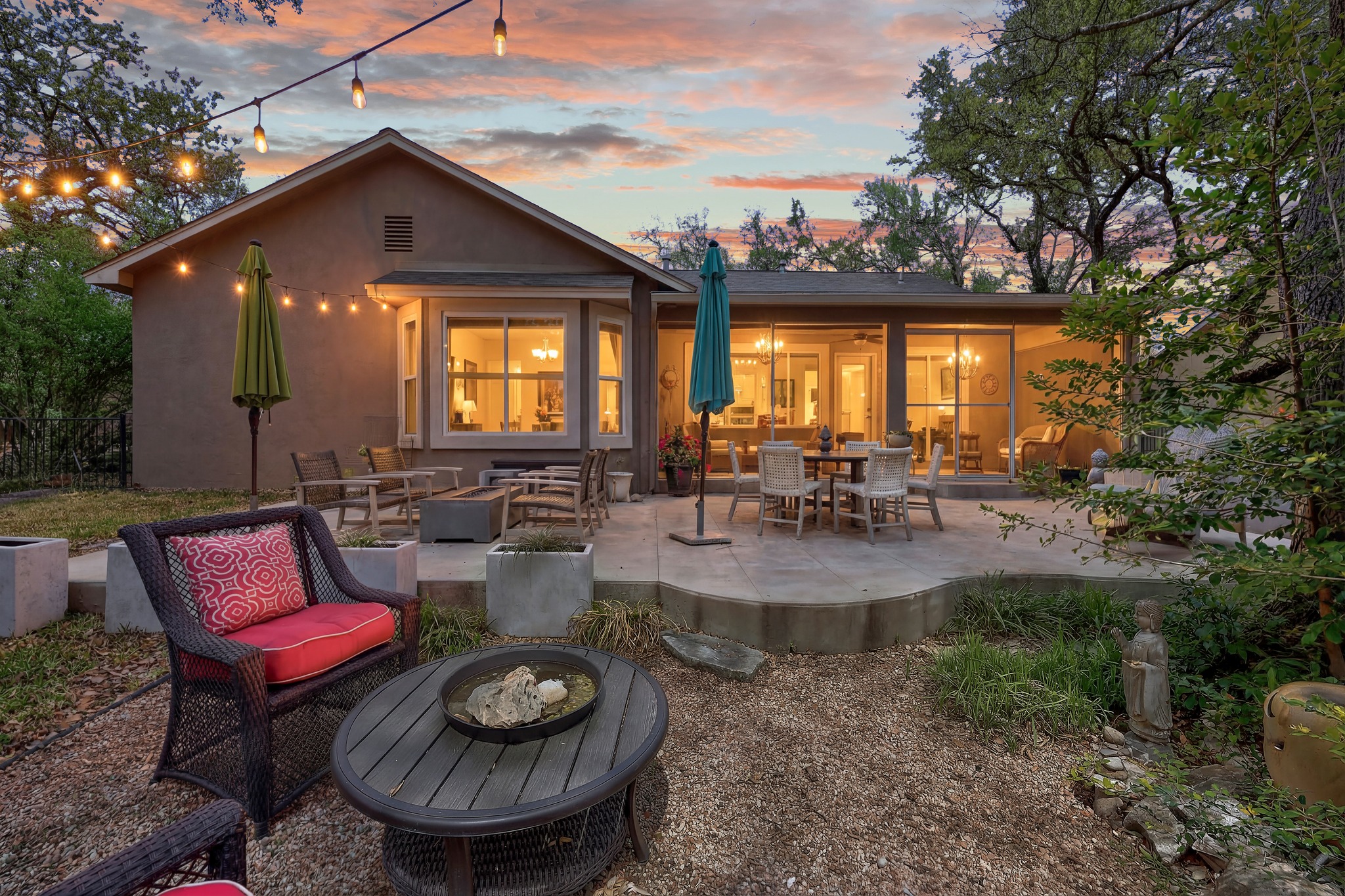 168 Dan Moody Trail Georgetown, TX 78633 - Photo 37 of 40 a view of a patio with couches table and chairs and potted plants