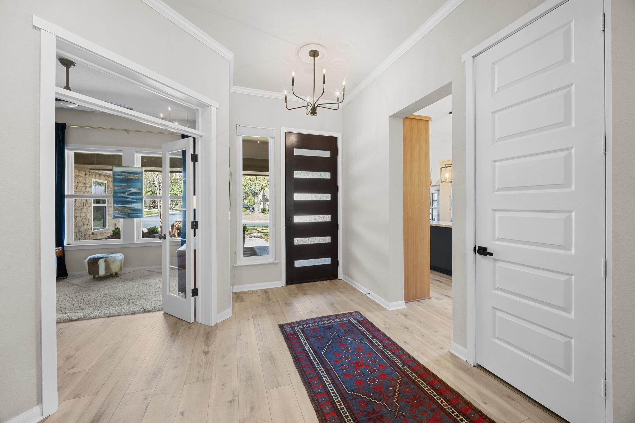 168 Dan Moody Trail Georgetown, TX 78633 - Photo 5 of 40 a view of a hallway with wooden floor and windows