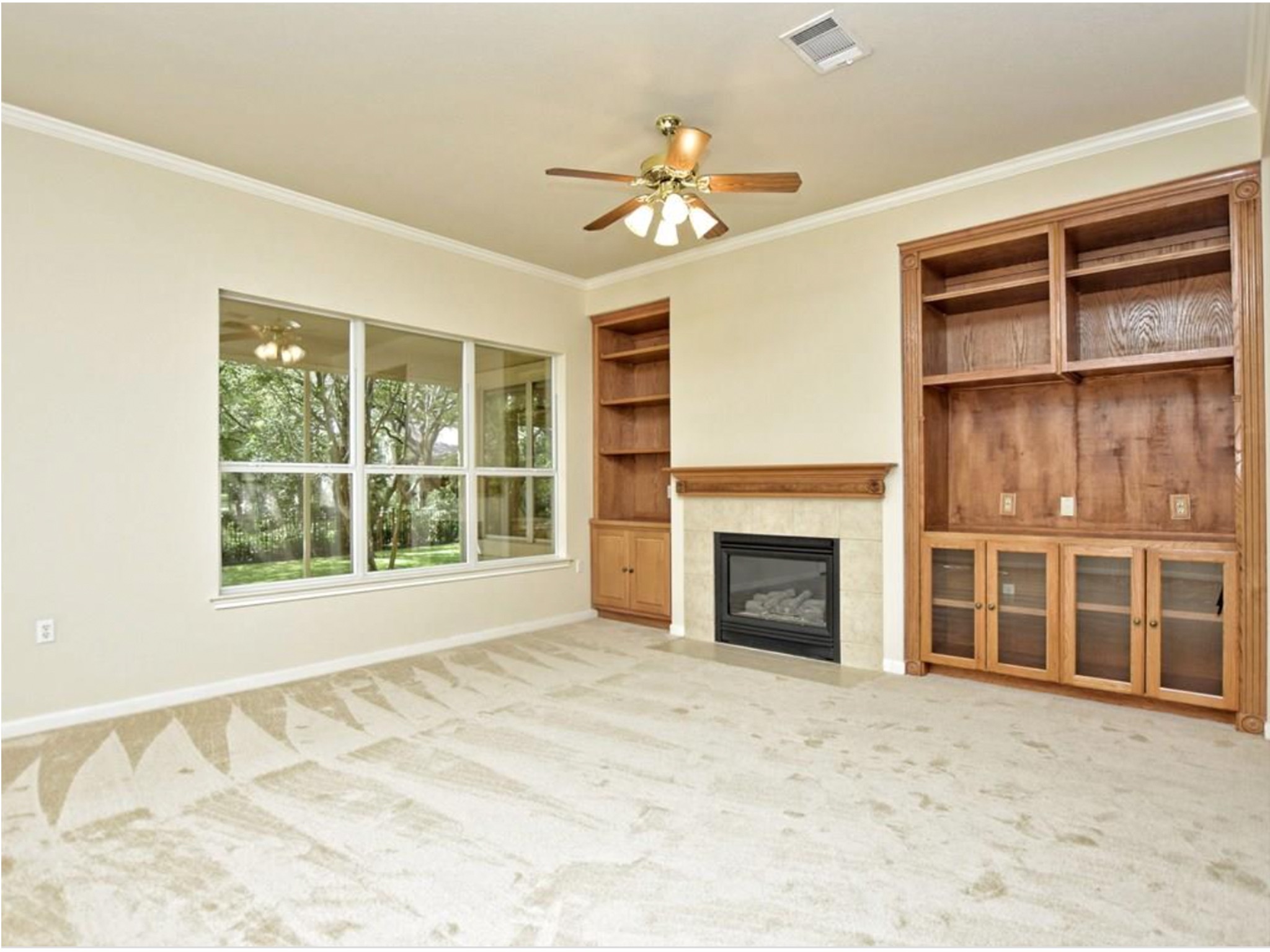 168 Dan Moody Trail Georgetown, TX 78633 - Photo 10 of 40 a view of an empty room with a fireplace and a window