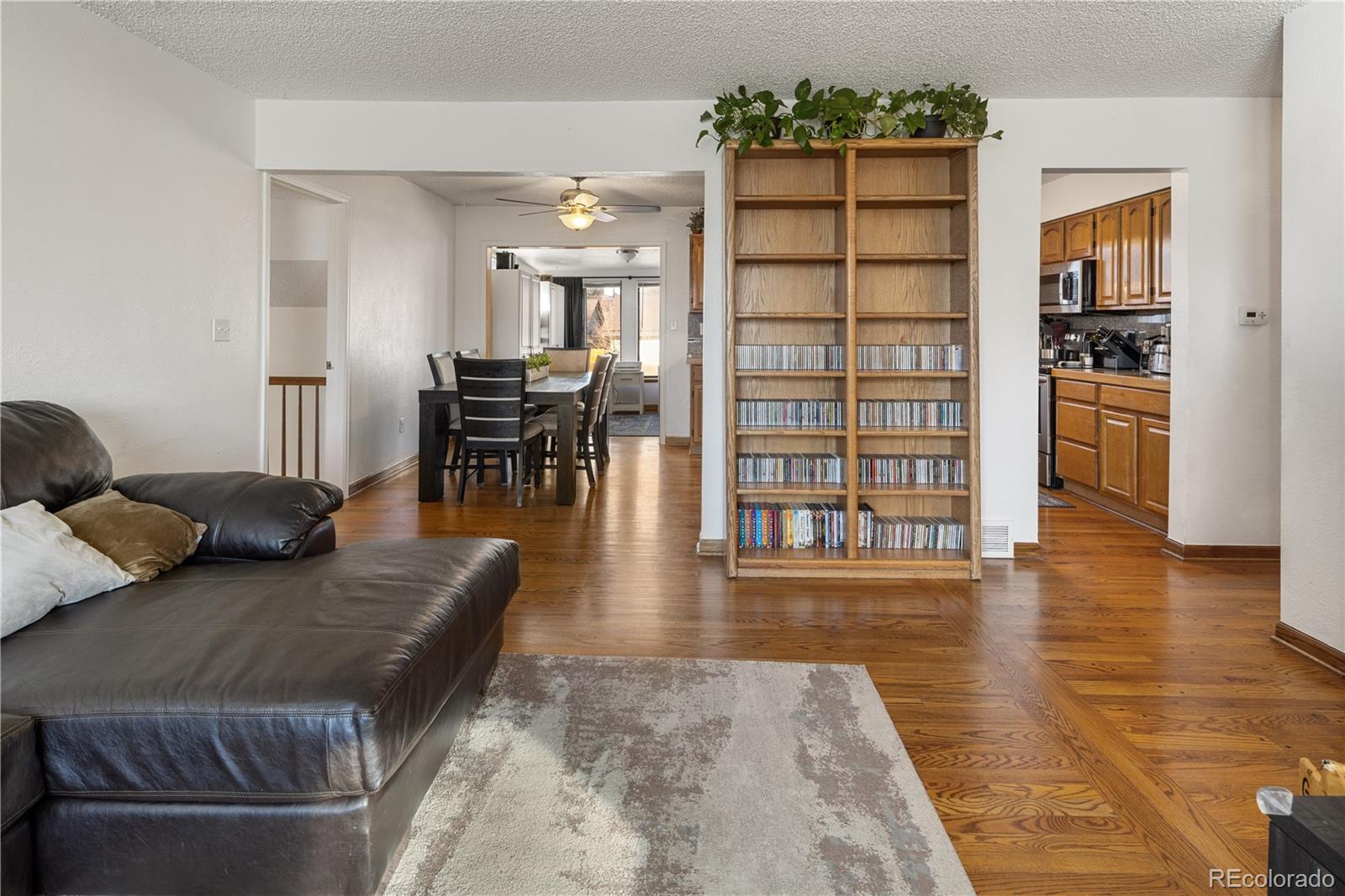 4615 Quail Street Wheat Ridge, CO 80033 - Photo 4 of 29 a living room with furniture and wooden floor
