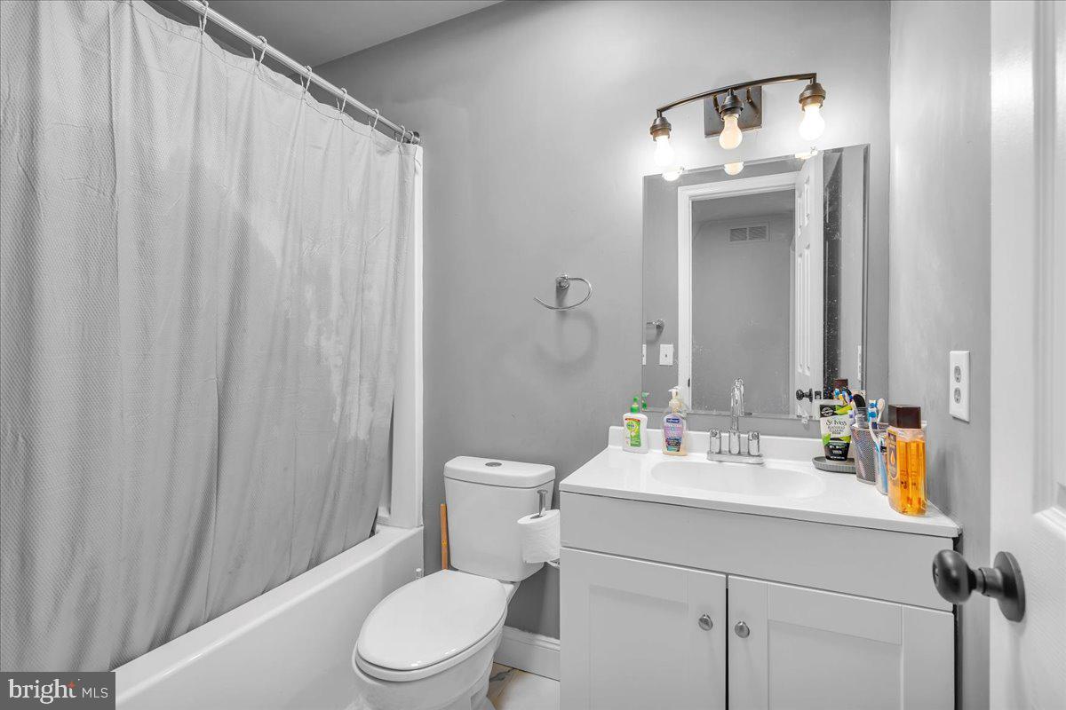 92 Ginger Drive Lumberton, NJ 08048 - Photo 15 of 19 a bathroom with a sink a toilet and shower curtain