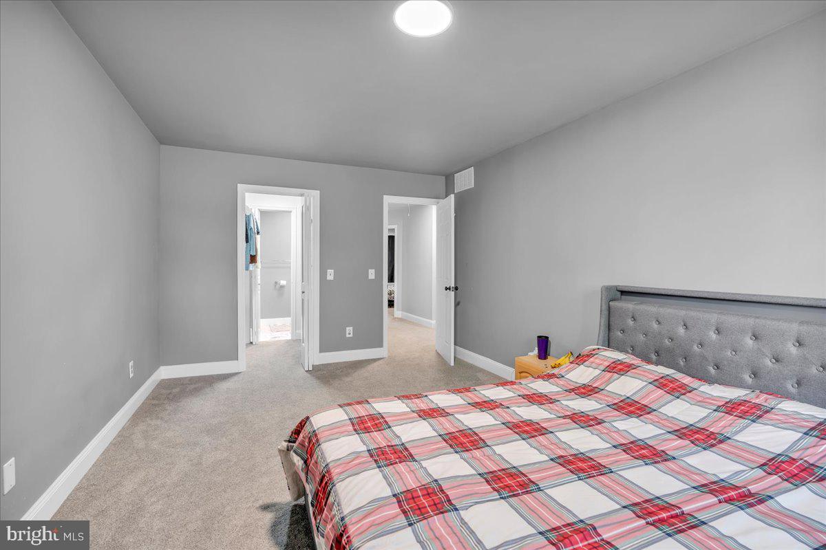 92 Ginger Drive Lumberton, NJ 08048 - Photo 17 of 19 a bedroom with a bed and a lamp