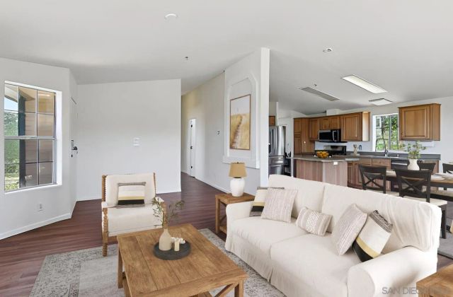 a view of a kitchen with a sink cabinets and wooden floor