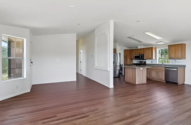 a kitchen with granite countertop a stove and a sink