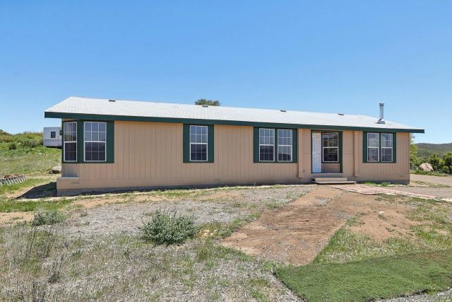 a house view with a garden space
