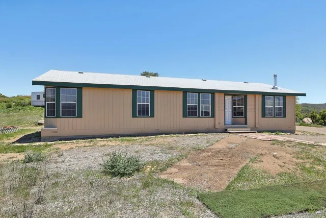 a house view with a garden space