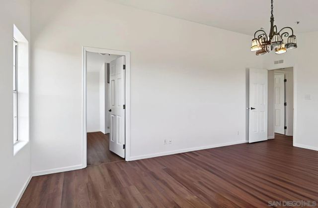 a bathroom with a sink double vanity granite tub and a mirror