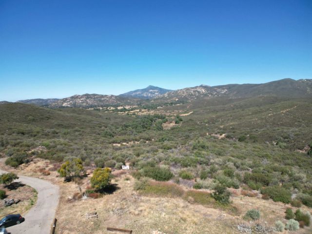 a view of a mountain with a mountain in the background