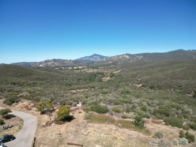 a view of a mountain with a mountain in the background
