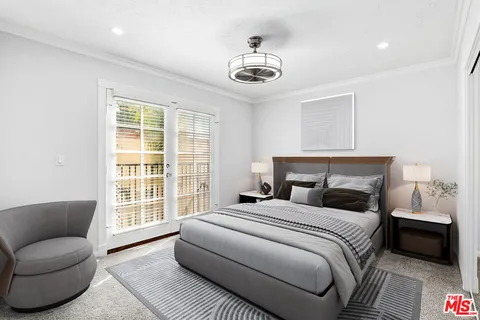 a bedroom with a bed and a couch