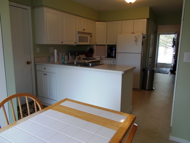 160 West Golf Road Libertyville, IL 60048 - Photo 8 of 12 a kitchen with stainless steel appliances a refrigerator sink and cabinets