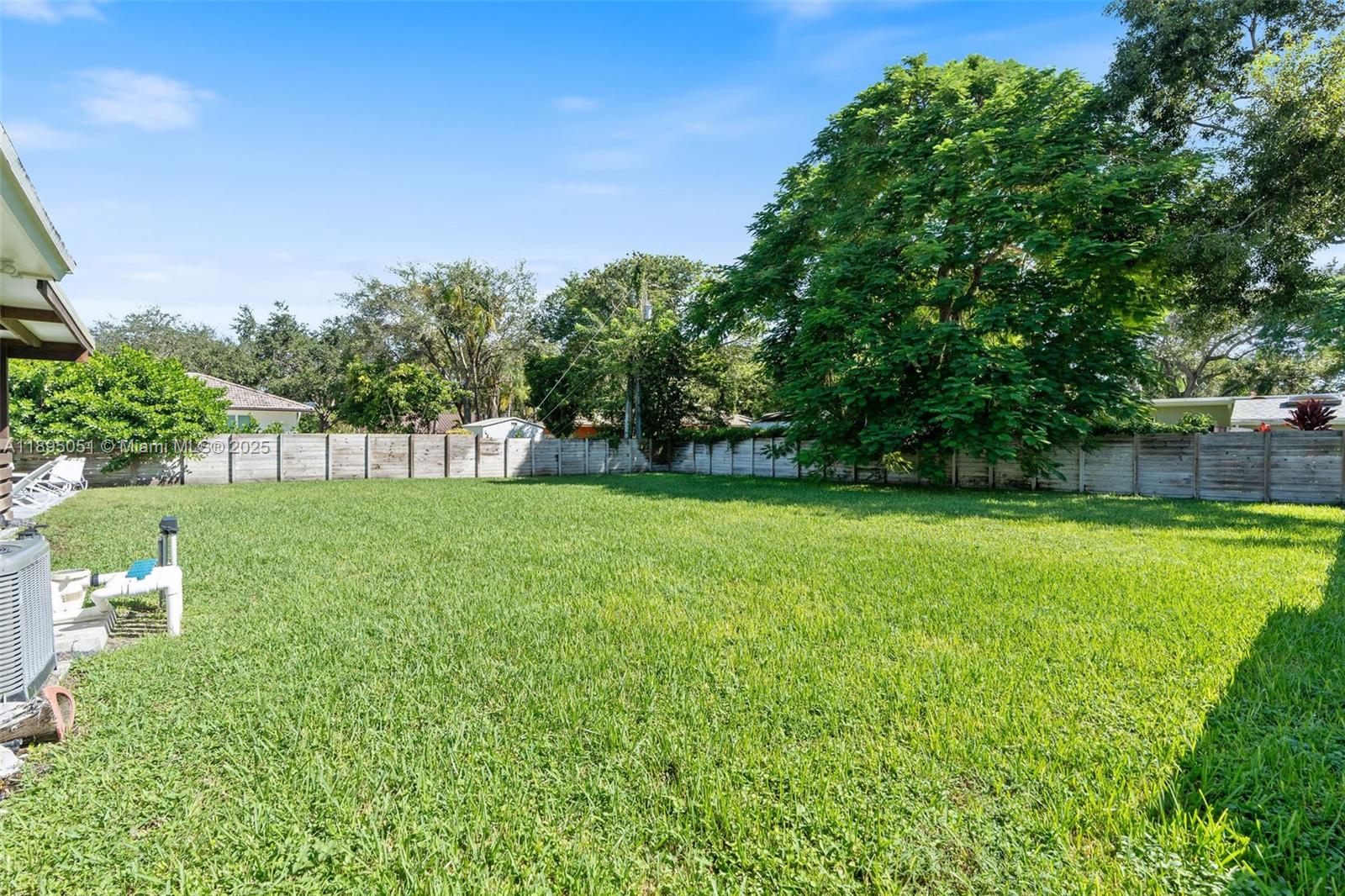 8121 Southwest 97th Terrace Miami, FL 33156 - Photo 14 of 38 a view of yard with swimming pool and green space