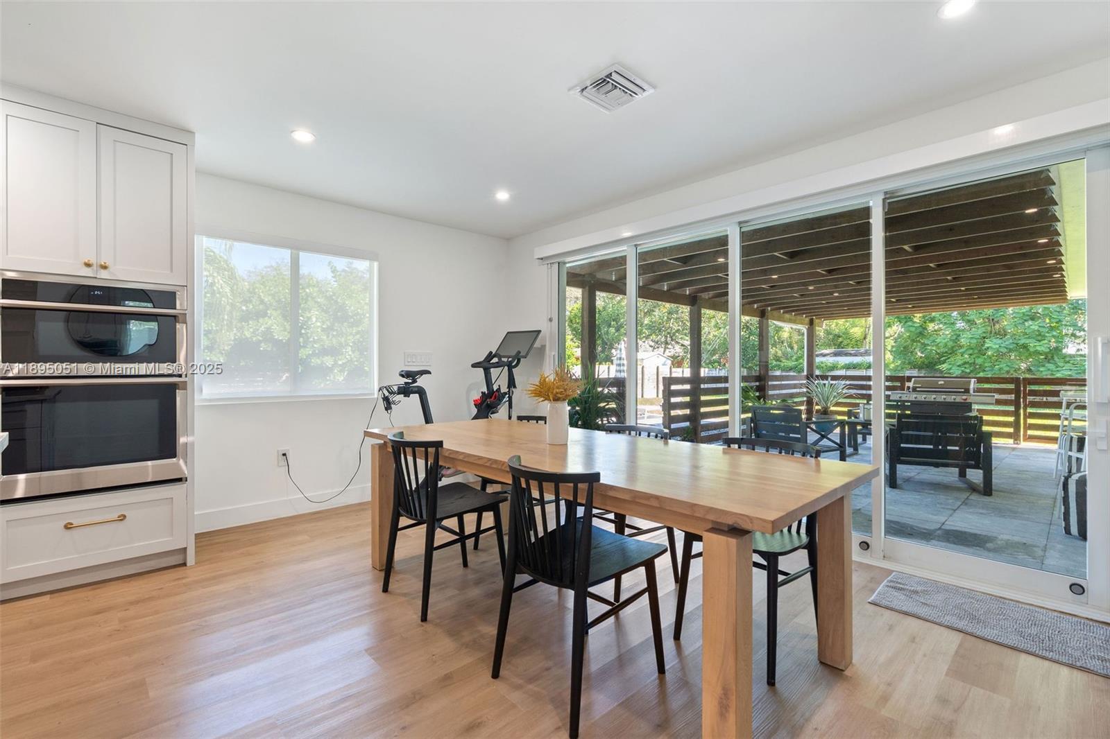 8121 Southwest 97th Terrace Miami, FL 33156 - Photo 18 of 38 a dining room with furniture window wooden floor