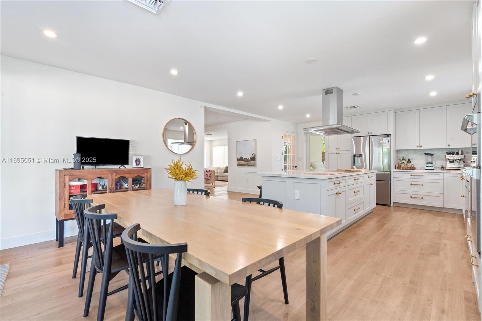 8121 Southwest 97th Terrace Miami, FL 33156 - Photo 19 of 38 a large kitchen with a table and chairs